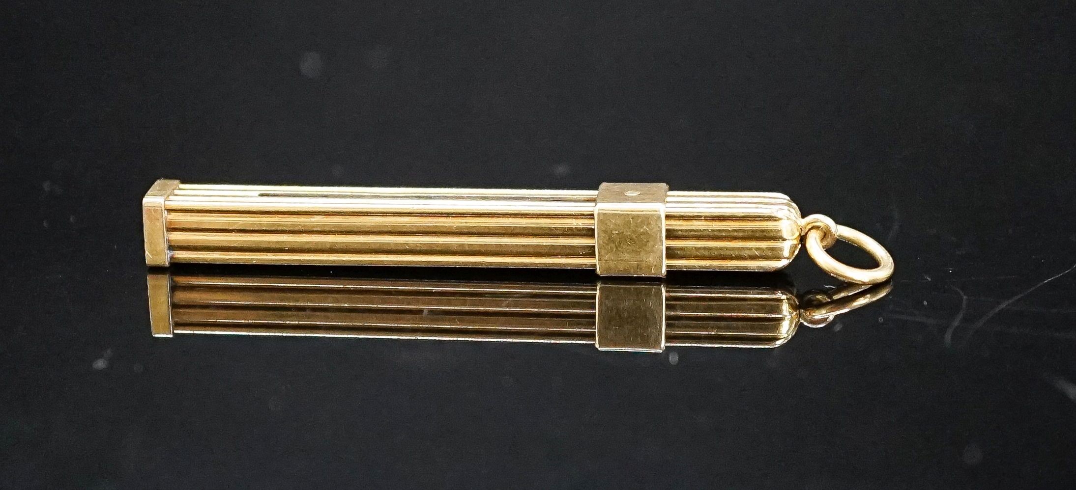 A yellow metal mounted tortoiseshell propelling toothpick, 52mm.